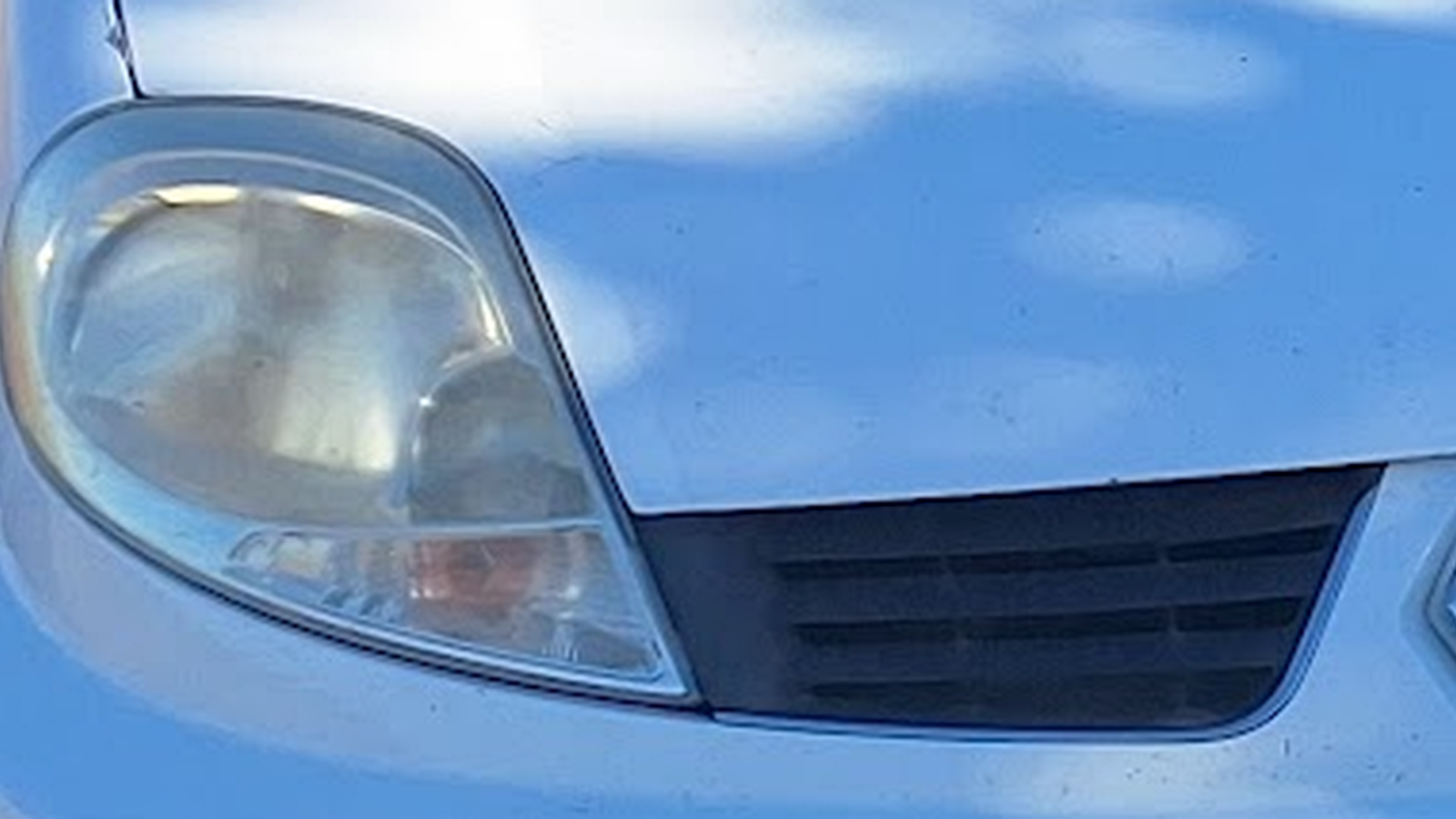 Before cloudy headlight restoration by Mr Headlights mobile service