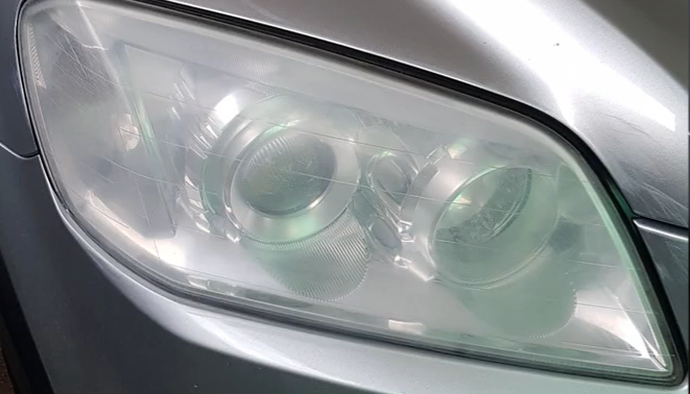 Before hazy car headlight restoration near Sunshine Coast
